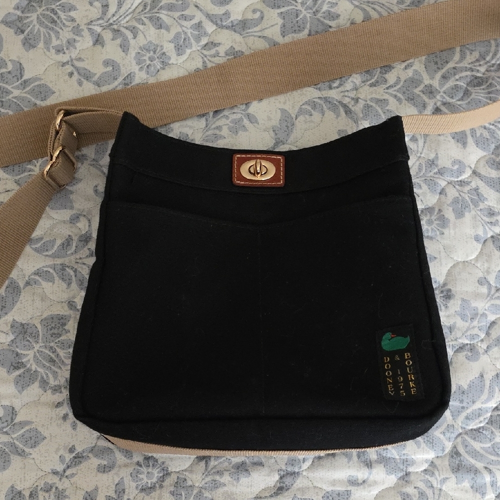 Dooney & Bourke Black and Tan Crossbody Bag with Minimalist Design